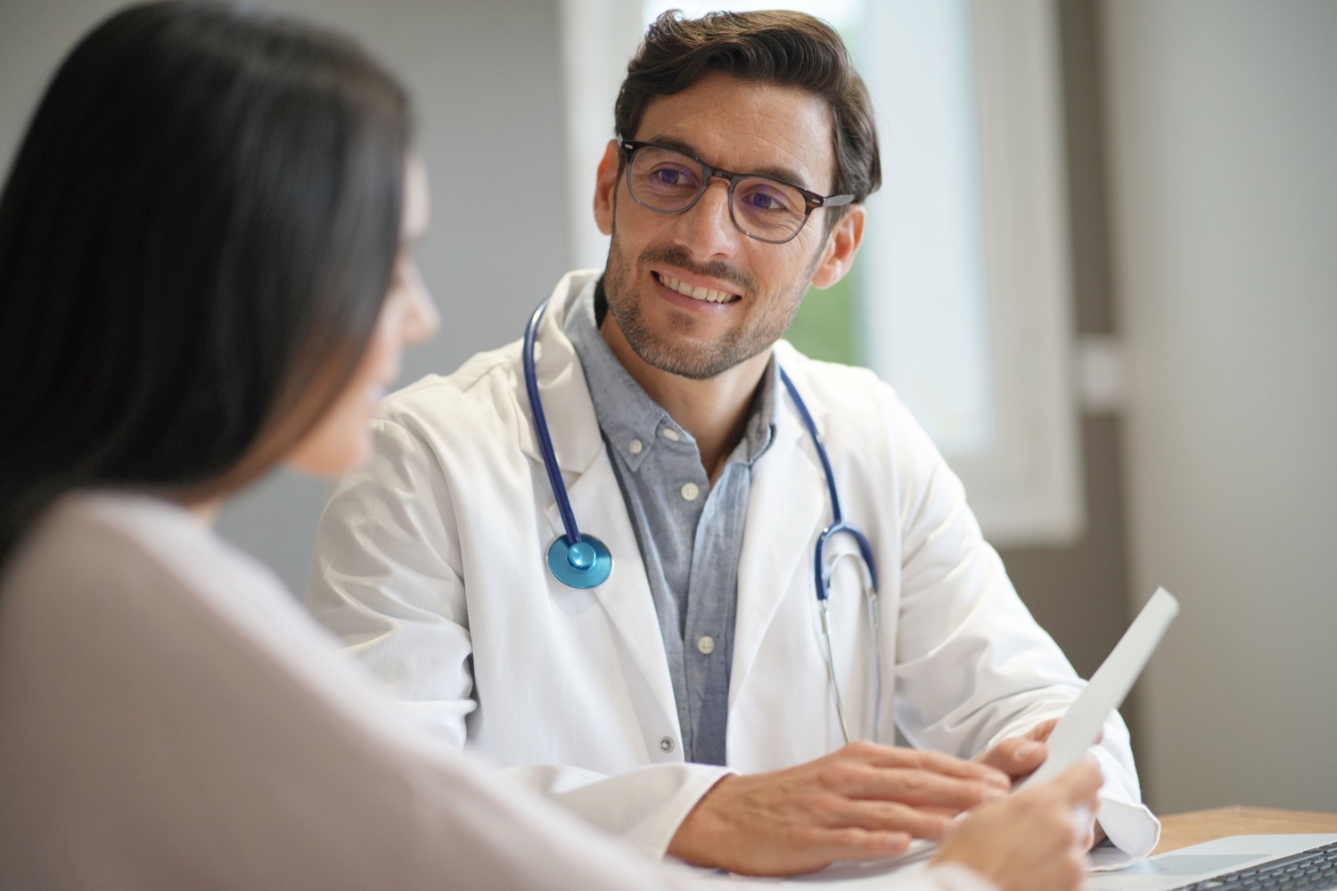 A doctor having a supportive conversation with a patient