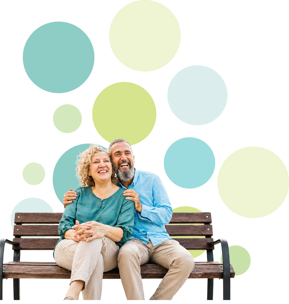 A smiling older couple sitting together on a park bench